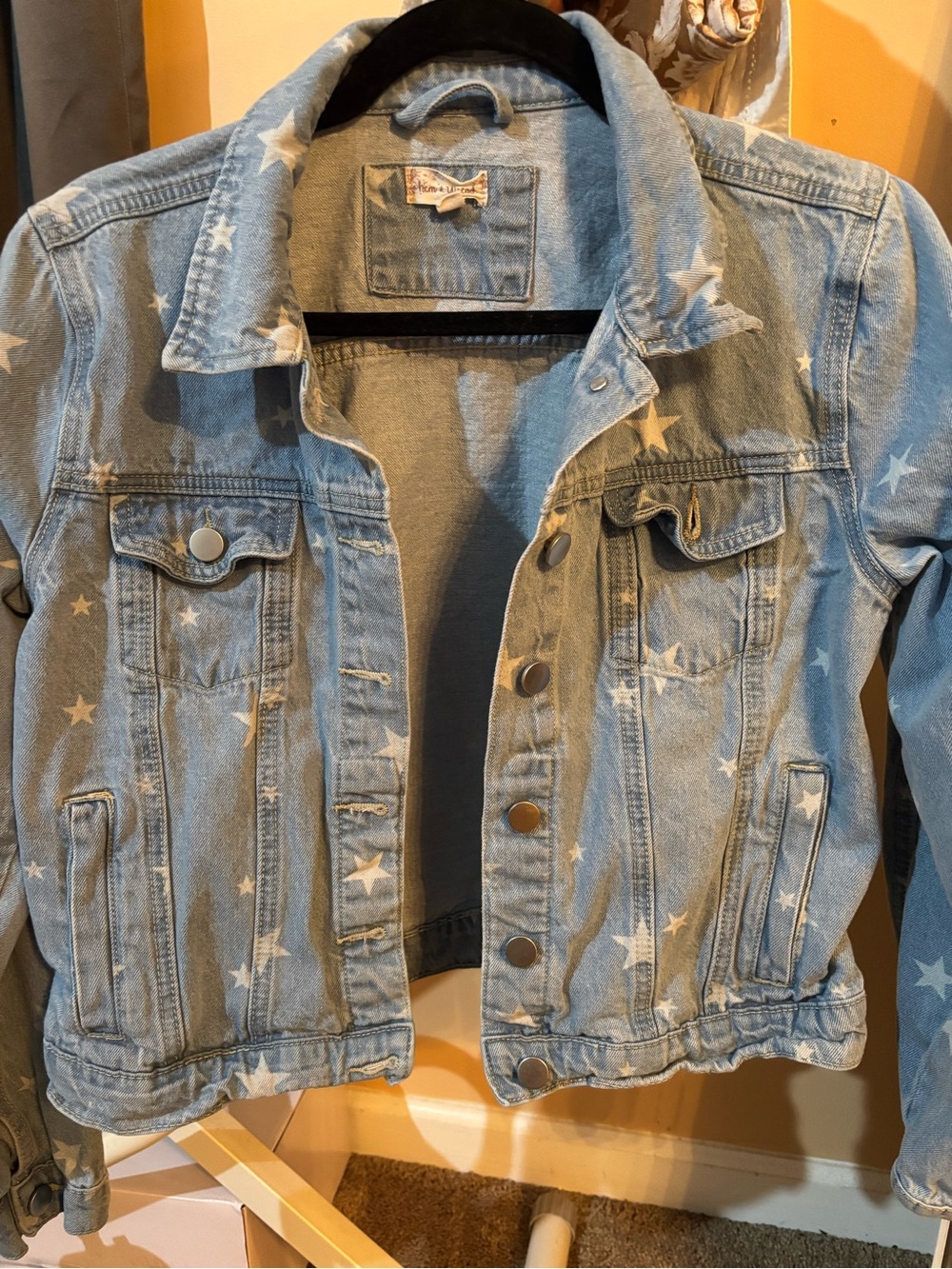 Stylish denim jacket with stars great for keeping warm.